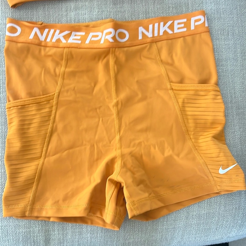 Nike Orange Athletic Shorts with Textured Panels